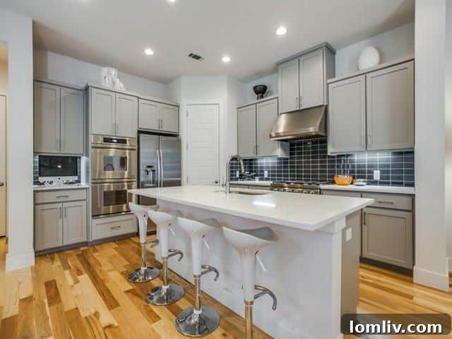 Architectural Excellence: Dallas Modern Townhome Tops Our Open House Guide 16 Elegant living space with hardwood floors