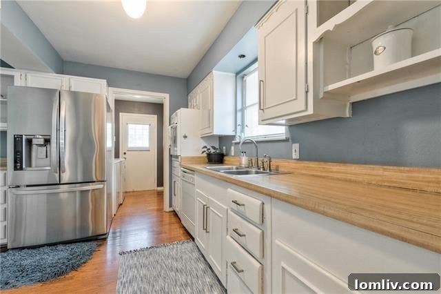 Architectural Excellence: Dallas Modern Townhome Tops Our Open House Guide 10 Updated kitchen with dining area