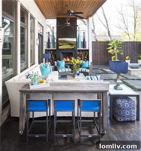 Lush Preston Hollow outdoor patio with fireplace and modern seating