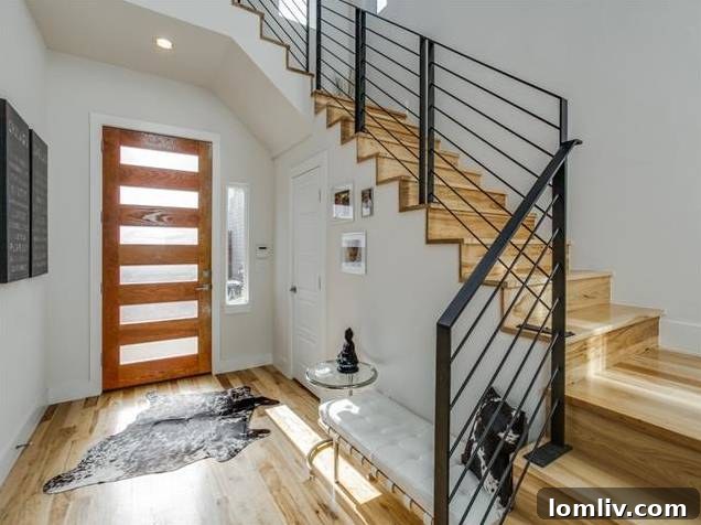 East Dallas Modern: Redefining Urban Life 4 Dramatic Two-Story Entryway with Steel Staircase