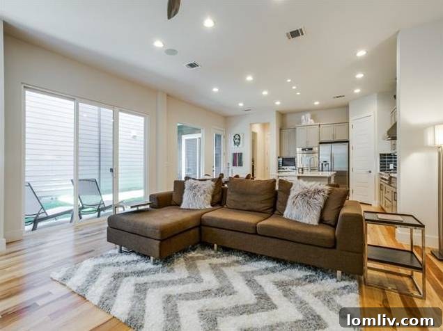 East Dallas Modern: Redefining Urban Life 8 Spacious Living Room Connecting to Kitchen