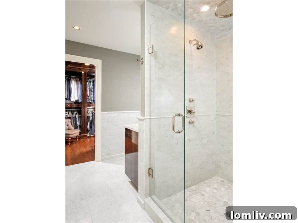 Elegant Her Bathroom with Carrara Marble and Waterworks Fixtures