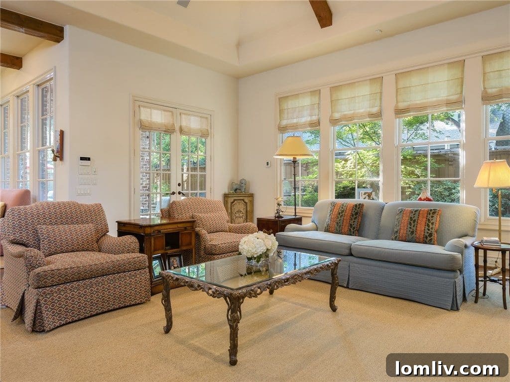 Another view of the grand family room showcasing its size and architectural details