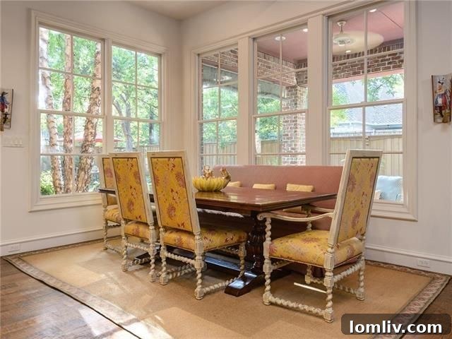 Bright breakfast room with panoramic views of the backyard and pool area