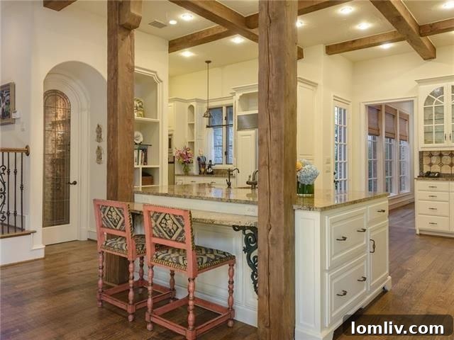 Spacious and well-lit kitchen, showcasing multiple workspaces and elegant design
