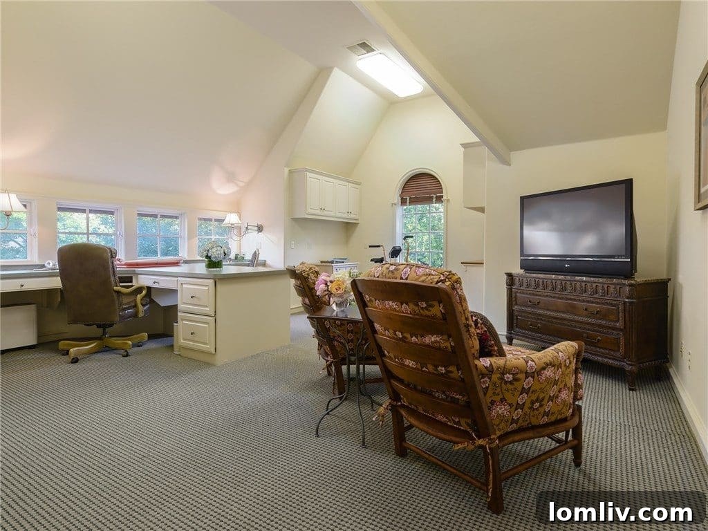 Large, well-appointed home office with built-in desks and ample storage