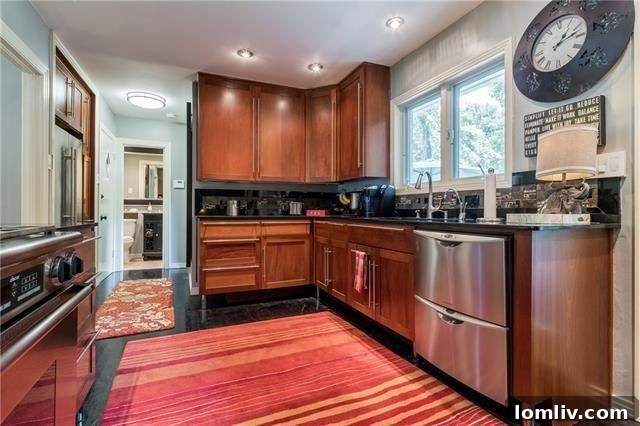 Updated kitchen with Shaker cabinets and stainless steel appliances
