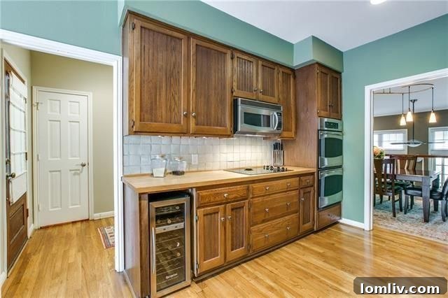 Updated kitchen with stainless steel appliances and breakfast area