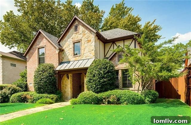 Elegant facade of newer custom Tudor home in Belmont