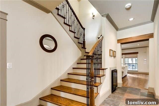 Spacious living area with hardwood floors and built-ins