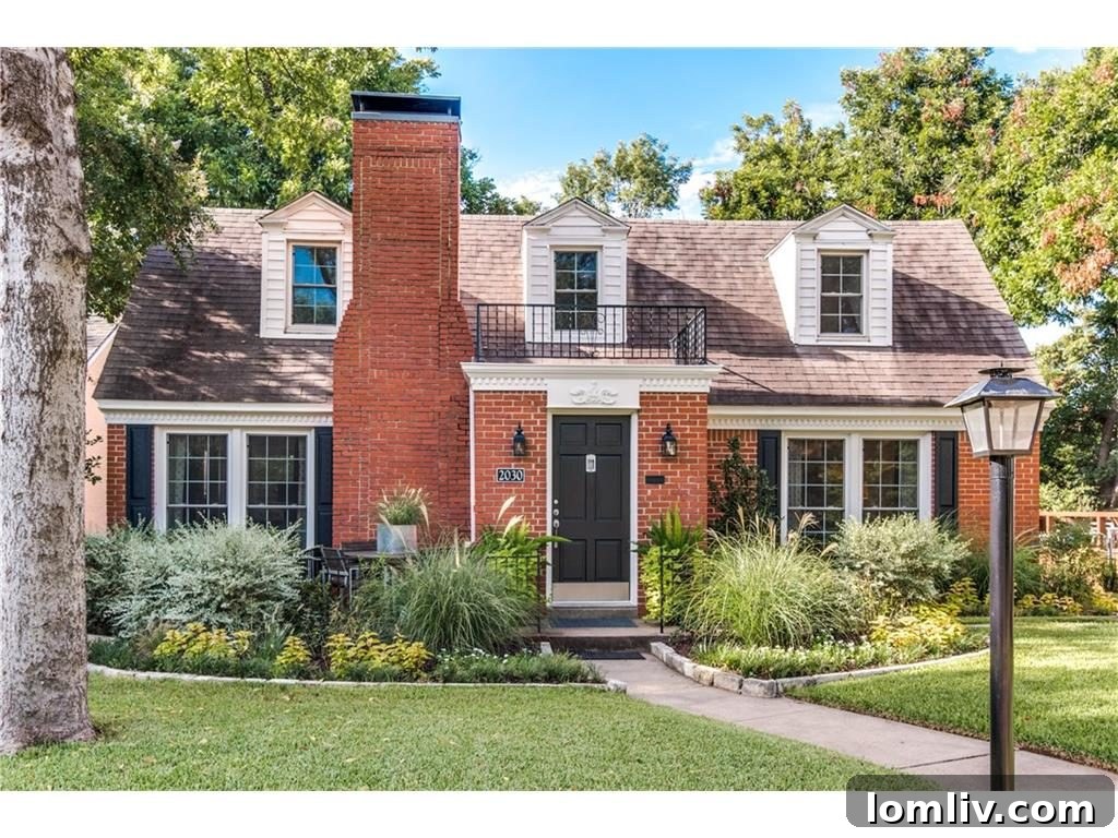Charming Cape Cod cottage exterior with mature landscaping and welcoming facade at 2030 Mayflower Drive in Stevens Park Estates, Oak Cliff