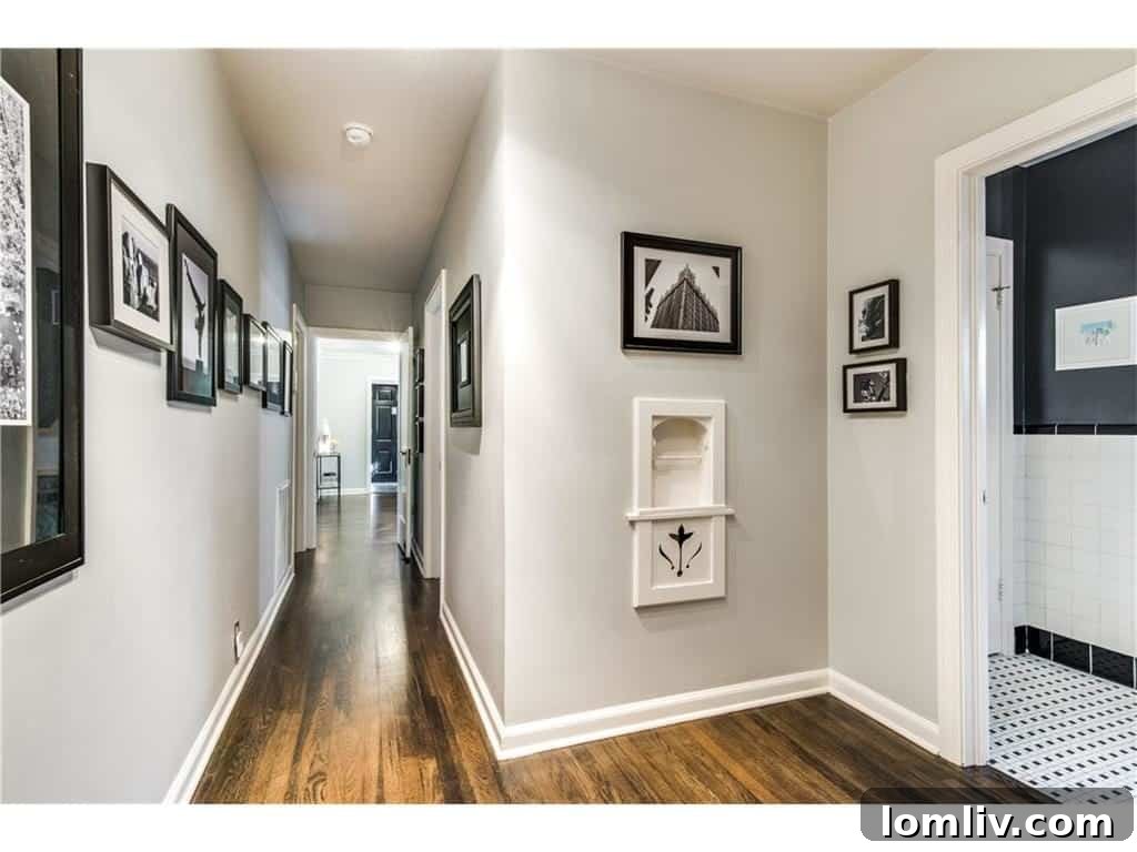 Luxurious master bathroom featuring a spacious walk-in shower with designer tiles, a double vanity, and modern design elements, creating a spa-like experience.