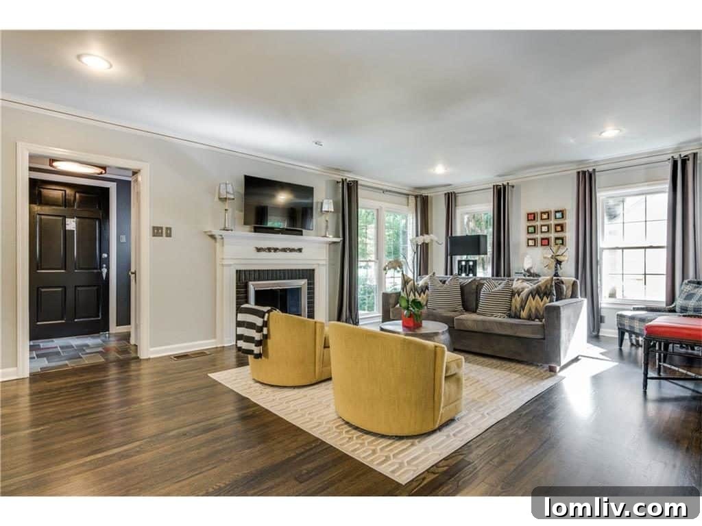 Modern kitchen featuring elegant subway tile, ample counter space for culinary endeavors, high-end stainless steel appliances, and custom cabinetry in a historic Stevens Park home, blending functionality with classic aesthetics.