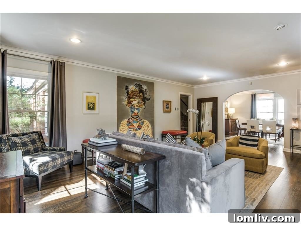 Cozy living room bathed in natural light, showcasing classic design elements, comfortable furnishings, and a welcoming ambiance, perfect for relaxation.
