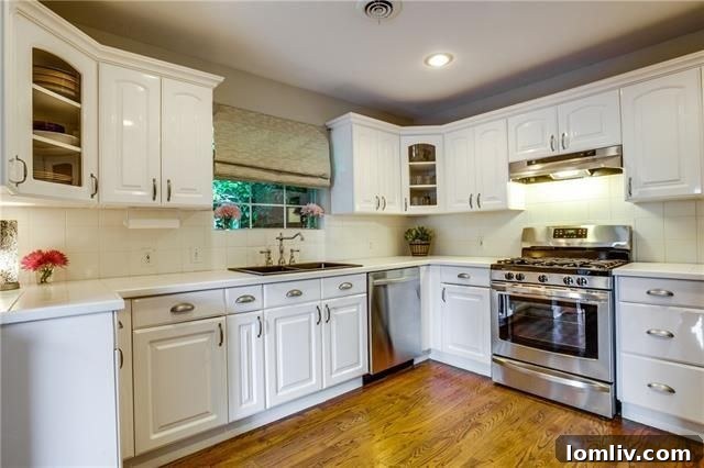 Updated kitchen with white cabinetry and breakfast room, 927 W. Greenbriar Ln