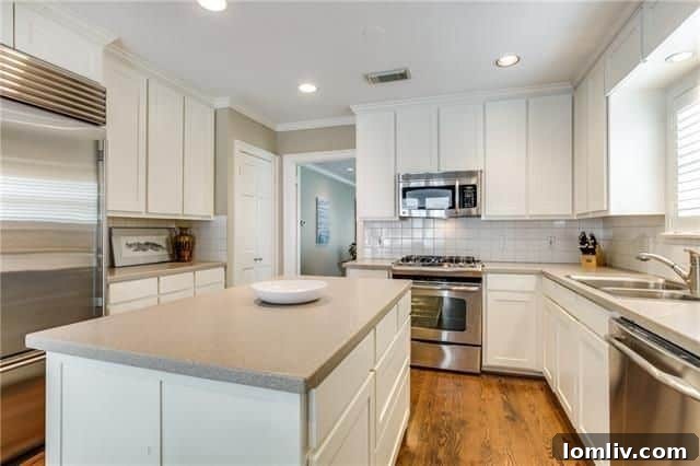 Modern kitchen with SubZero refrigerator, 4684 S. Versailles Ave