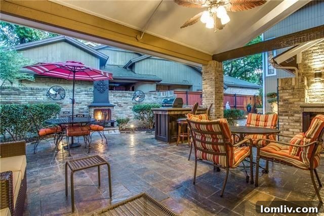 Living Room with Vaulted Ceilings and Brick Fireplace 6411 Larmanda St