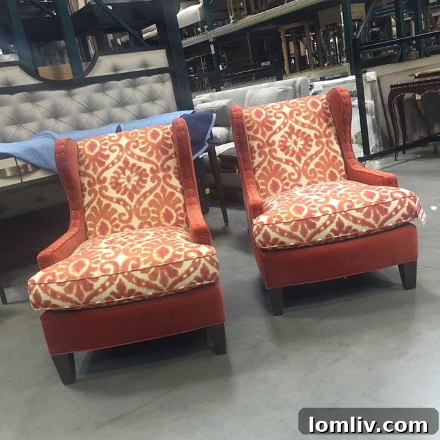 Pair of sophisticated upholstered chairs positioned by a bright bay window for shared comfort and reading