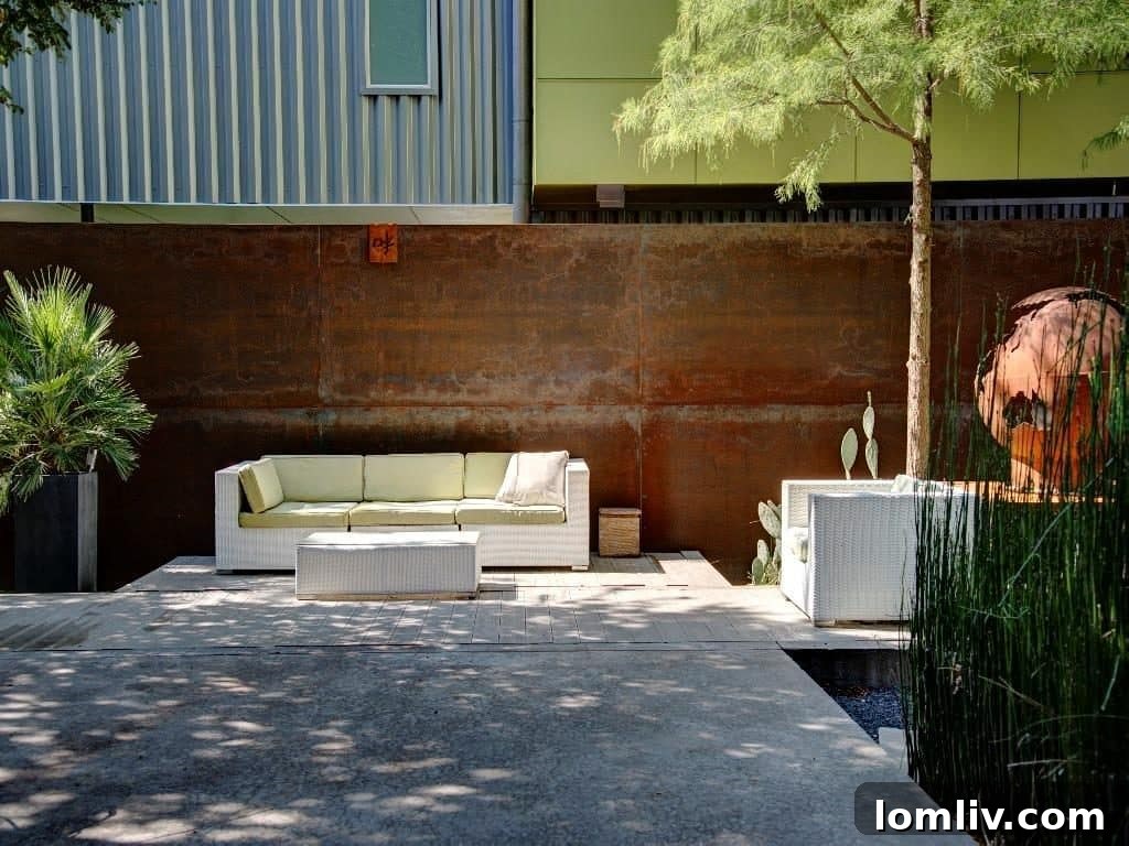 Exquisite iron fence by Luis Obregon enhancing exterior aesthetics