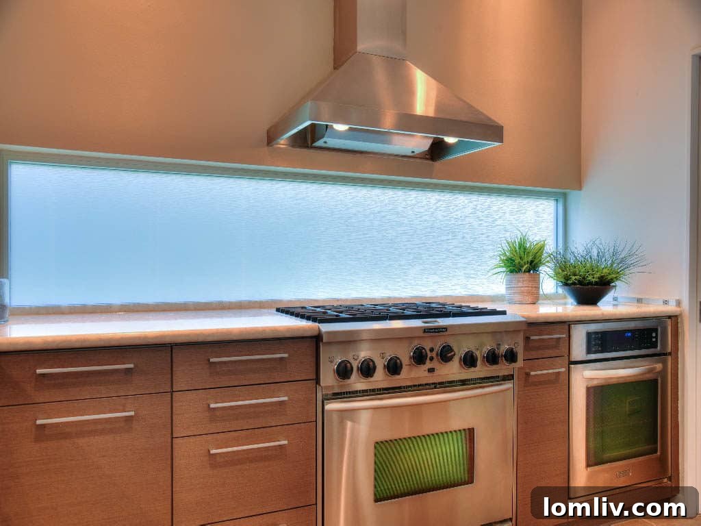 Contemporary kitchen with reconstituted granite and Corian island