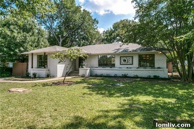 Spacious open concept living area with dark hardwood floors