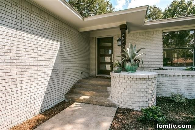 Modern dining space with elegant lighting and open kitchen view