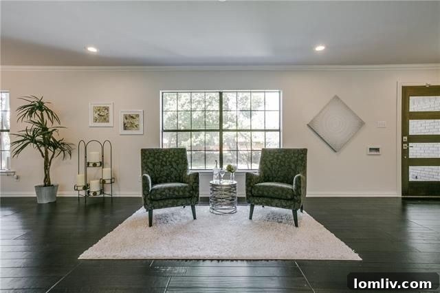 Stainless steel farm sink with modern faucet in a renovated kitchen