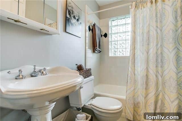 Exterior view of the back of the house with mature trees