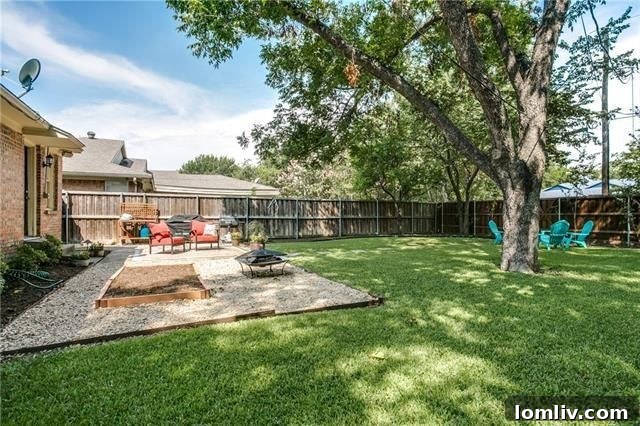 View of the well-maintained lawn and landscaping from a different angle
