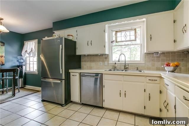 Dining area adjacent to the kitchen, showing hardwood floors