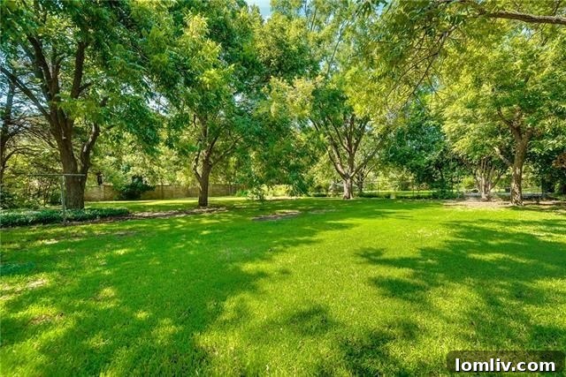 Spacious backyard with mature trees at 2928 Larkspur Ln