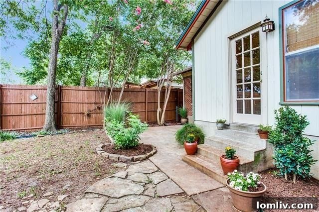 Well-maintained backyard with detached garage at 823 Stewart Dr