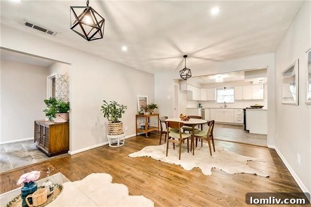 Bright living room with original refinished hardwood floors at 2928 Larkspur Ln