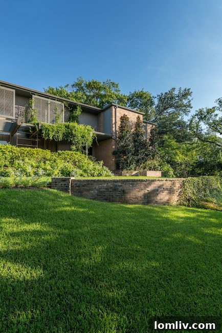 Exterior shot of a classic O'Neil Ford structure, showcasing his signature use of natural materials