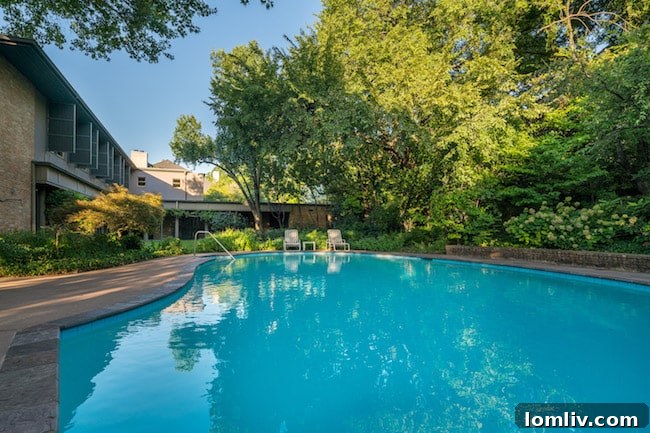 Relaxing pool and patio area, an essential feature of this luxurious Highland Park home