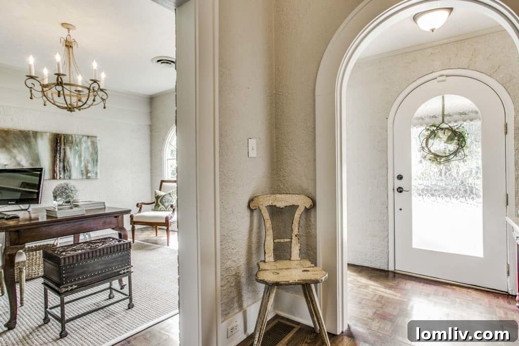 Renovated front porch converted into a vestibule and study with whitewashed brick