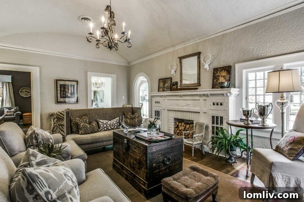 Bright living room featuring original hardwood floors and a neutral palette