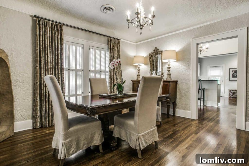Modernized galley kitchen with granite countertops and stainless steel appliances