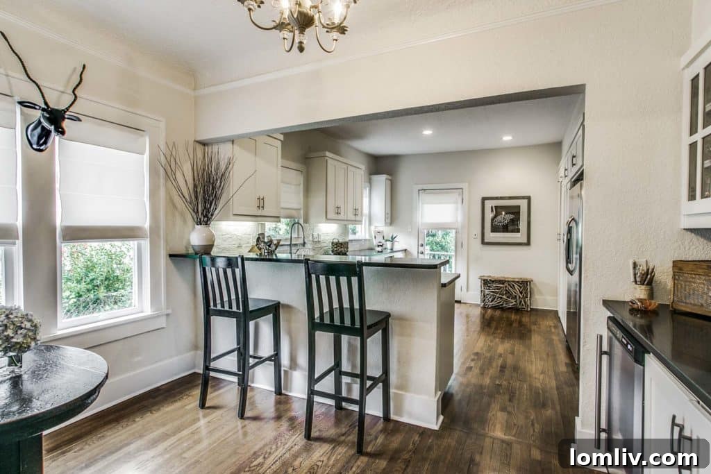 Master bedroom with elegant decor and ample space, part of a redesigned floor plan