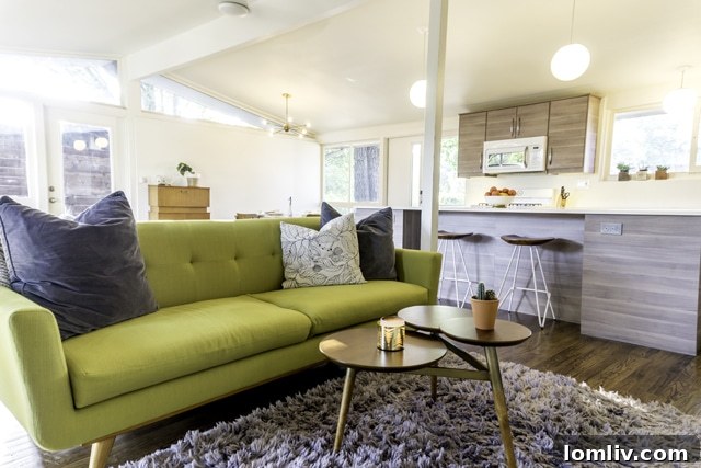 The open-plan living room and kitchen area, highlighting modern design and functionality
