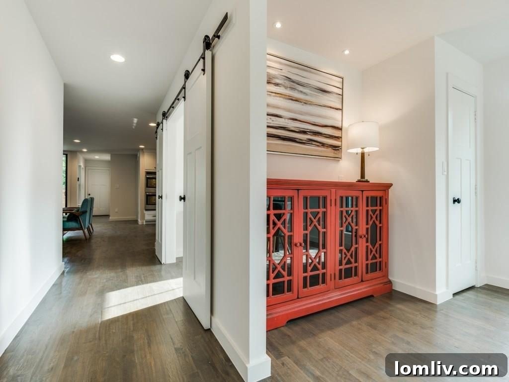 Barn Doors Leading to a Flexible Room in a Modern Home