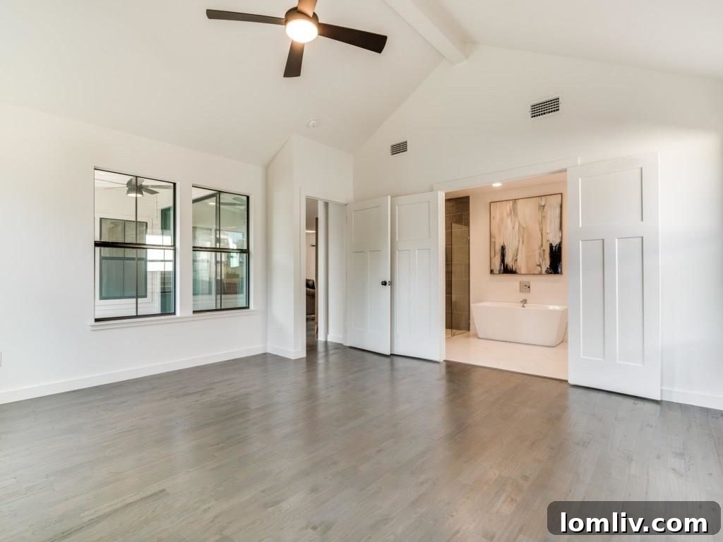 Spacious Master Suite with Vaulted Ceiling and Exposed Beam