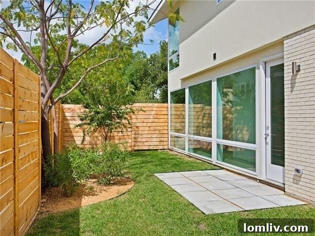 Private fenced backyard with patio space at 4711 Live Oak St. Unit 1