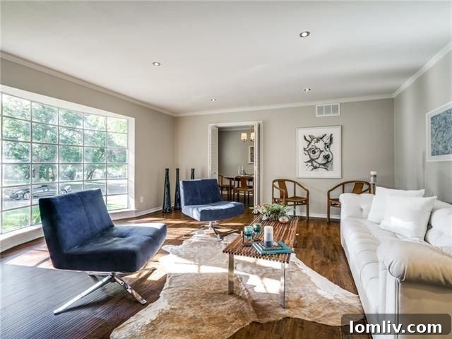 Radiant North Highlands Estate Steals the Show at Dallas Open Houses This Weekend 19 Spacious living room with fireplace and recessed lighting at 5852 Clendenin Ave.