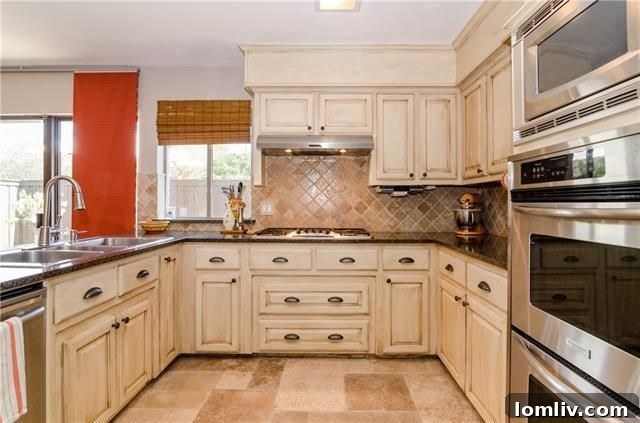 Radiant North Highlands Estate Steals the Show at Dallas Open Houses This Weekend 25 Contemporary kitchen with granite countertops and stone tile backsplash at 6935 Echo Bluff Dr.