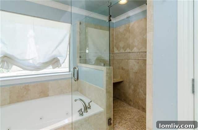 Radiant North Highlands Estate Steals the Show at Dallas Open Houses This Weekend 26 Luxurious master bathroom with travertine sinks and jetted tub at 6935 Echo Bluff Dr.