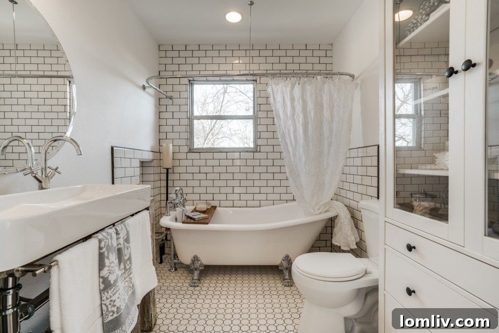 The meticulously updated bathroom at 9014 Daytonia Ave., showcasing a blend of classic and contemporary finishes.