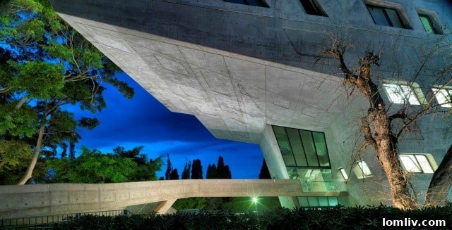 Architecture Group's 20th Anniversary Inaugurated by Aga Khan Award Lecture 2 Issam Fares Institute in Beirut, Lebanon, by Zaha Hadid Architects. Modern architectural design with angular forms and sustainable elements.
