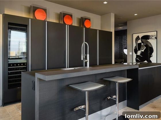 Elegant custom Italian kitchen with hidden appliances and glass countertops in The House Dallas