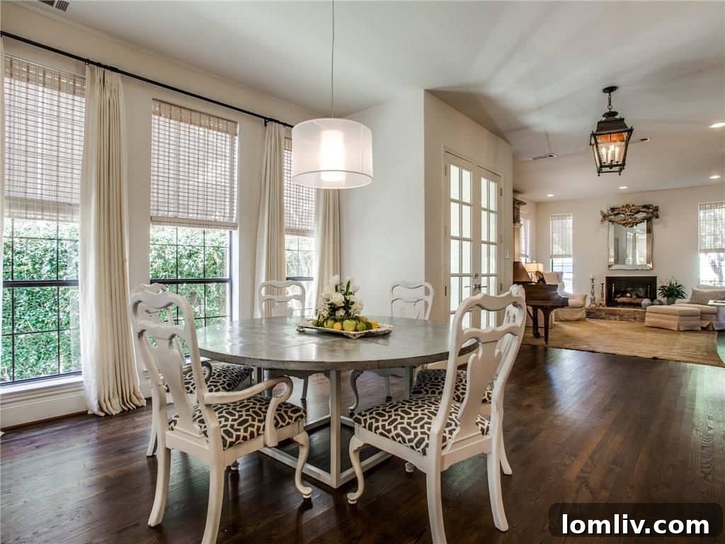 Elegant staircase with modern railing design in the renovated Park Cities residence